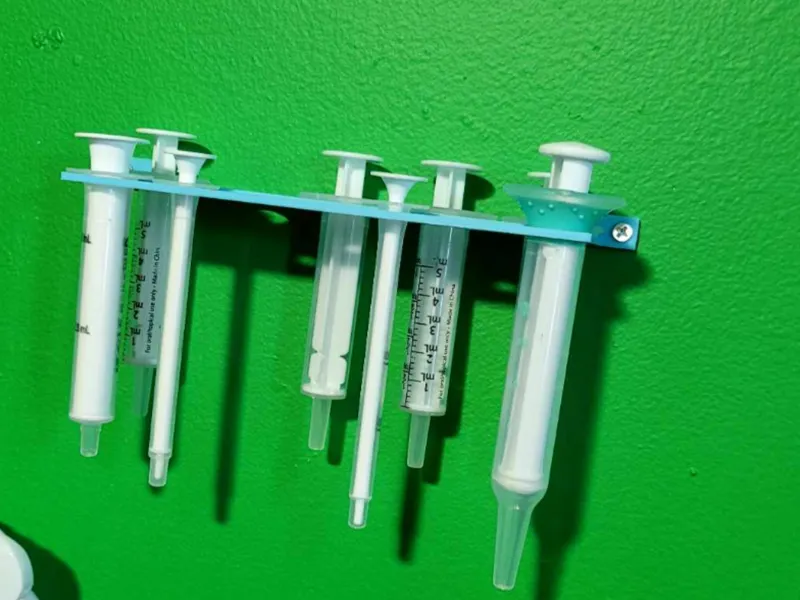Baby Oral Syringe Wall Hanger