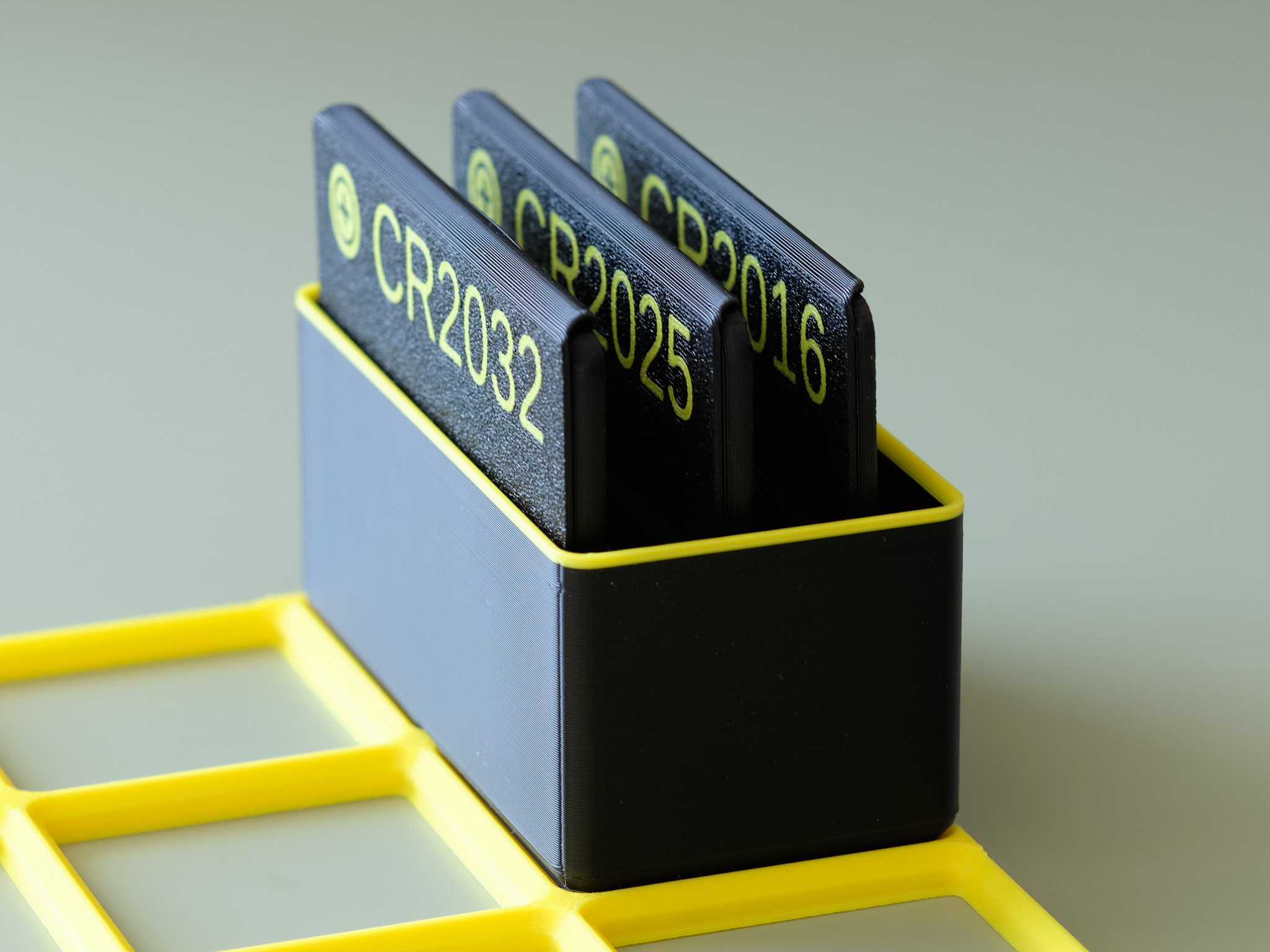 Coin cell battery cards in a Gridfinity box - 1