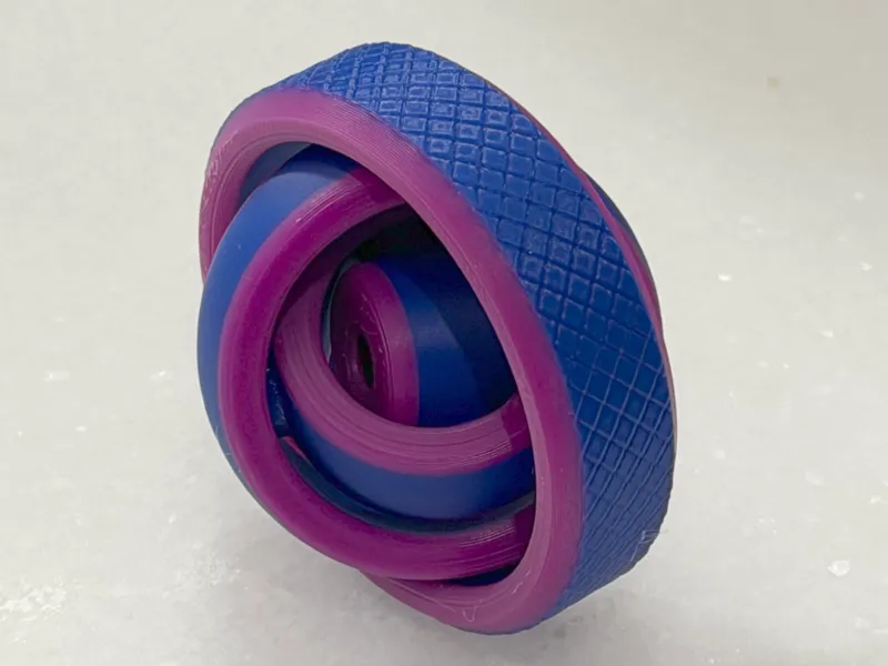 Multicolor, textured four-ring gyro fidget spinner