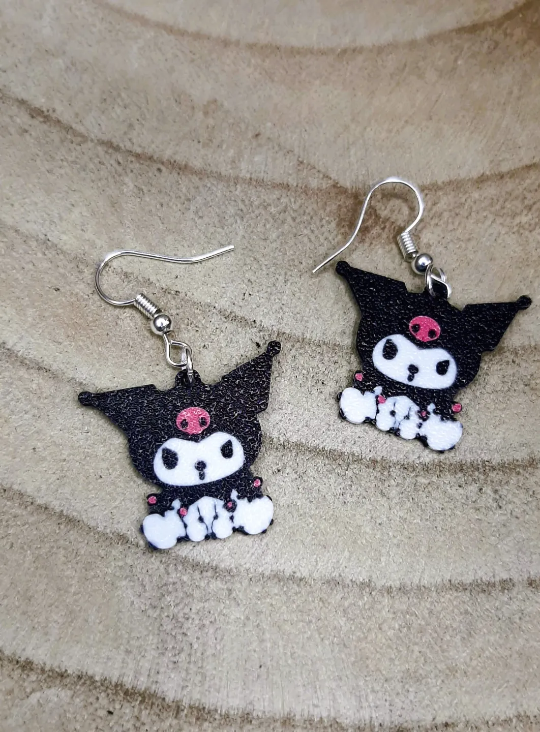 Sitting Kuromi earrings view 2