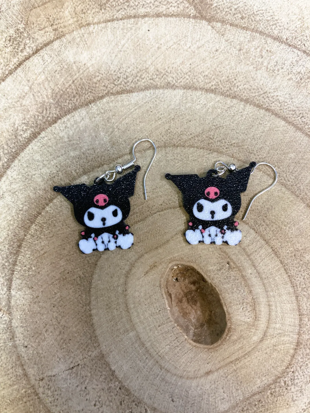 Sitting Kuromi earrings view 3