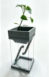 This flower pot creates a floating island rain effect when watered