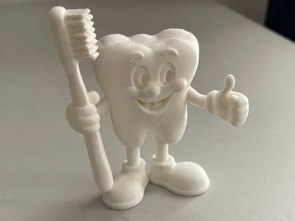 Figurine dent avec brosse à dents