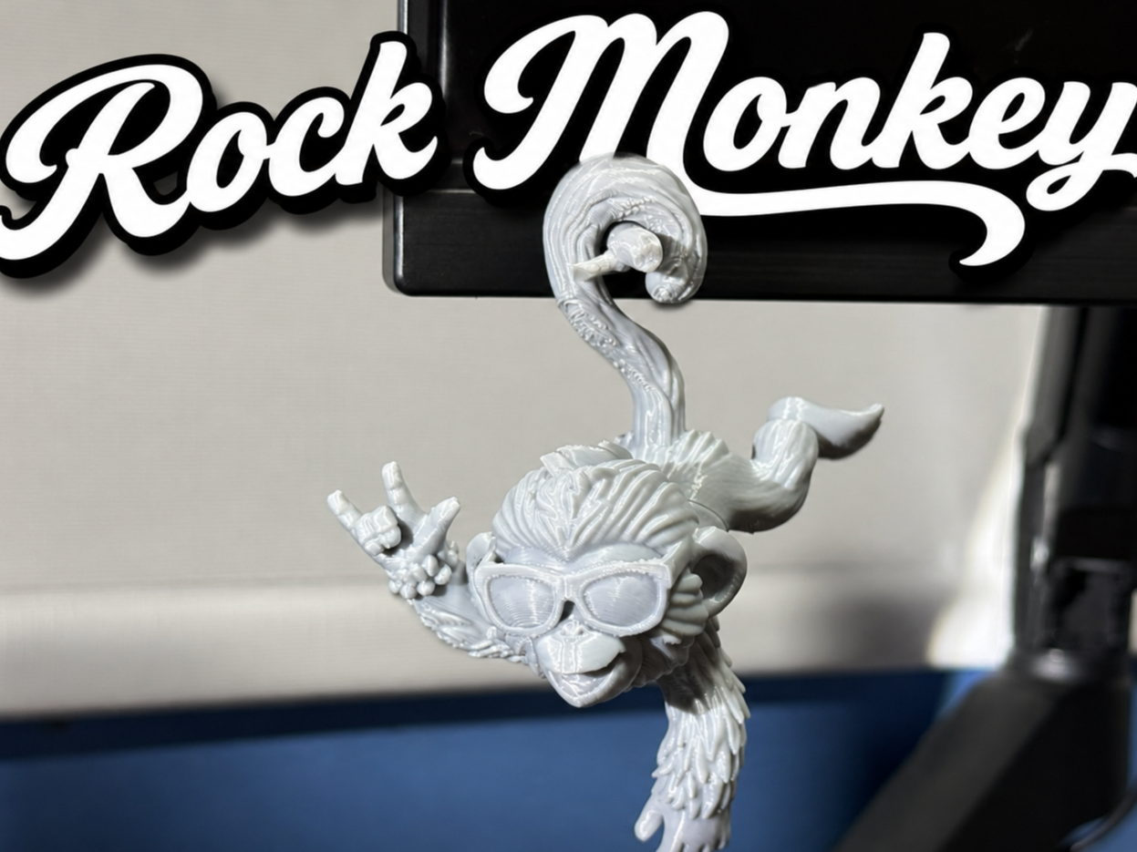 Rock monkey for hanging