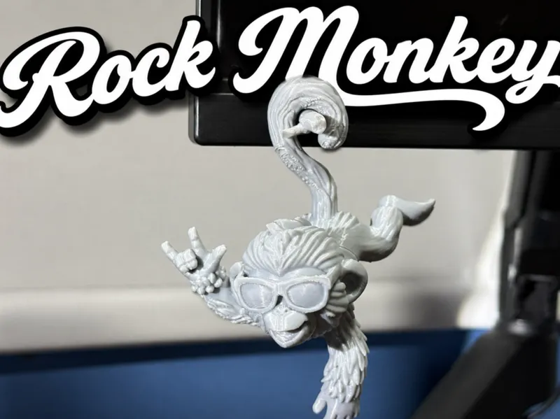 Rock monkey for hanging