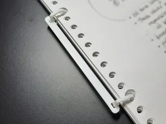 Thin-spine 2-ring binder for loose leaf paper
