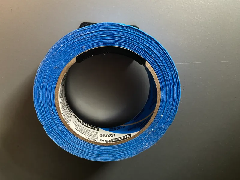 Minimalist magnet-mounted tape holder