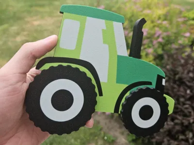 Magnetic tractor toy with rotating wheels