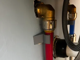 PEX pipe command strip mount