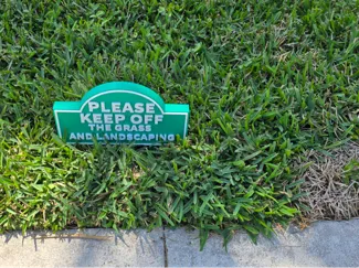 Keep off the grass and landscaping signs