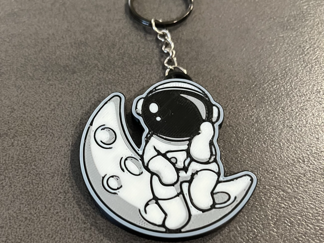 cute astronaut on the moon keychain