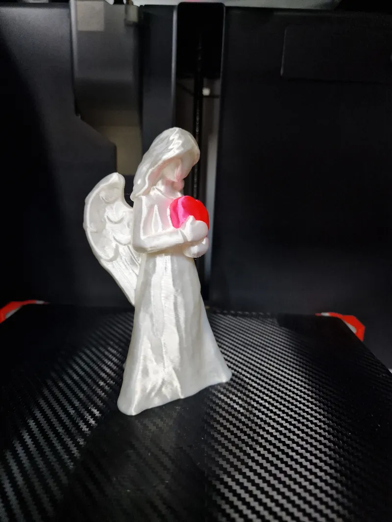 White angel with red heart