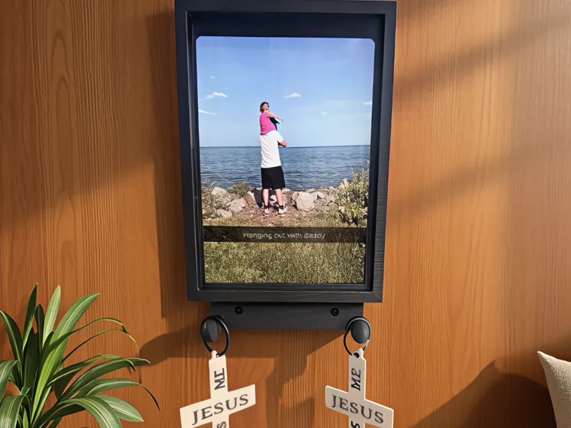 Slide in Picture frame with hanging hooks.