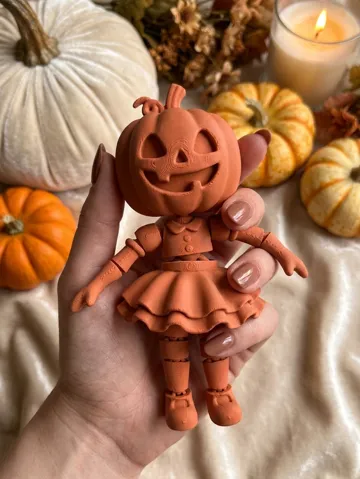Objeto manipulable: Articulated Halloween Pumpkin Girl Fidget Toy — vista de referencia 2