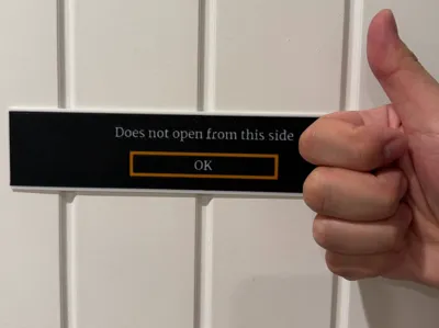 "Does not open from this side" Sign