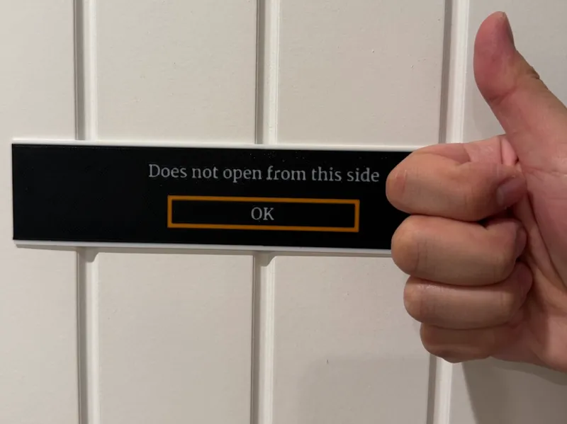 "Does not open from this side" Sign