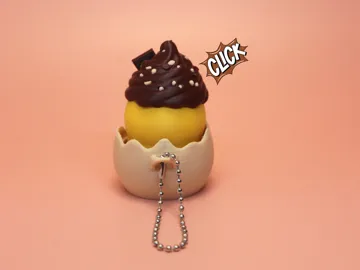 Objeto manipulable: Swirl Hatchling Egg Clicker Fidget Toy — vista de referencia 4