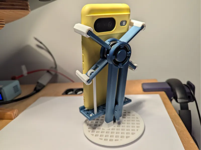 Spring loaded phone stand