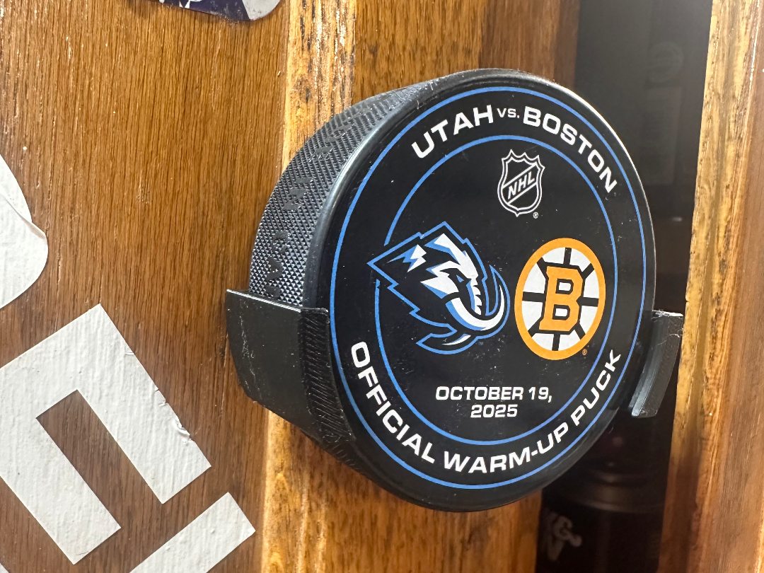 Hockey puck wall mount holder