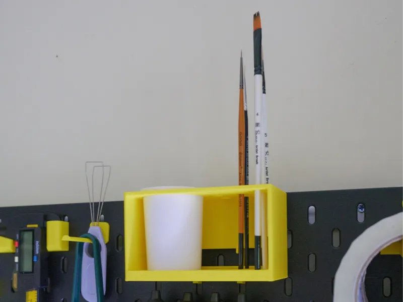 Skadis brush storage with cup