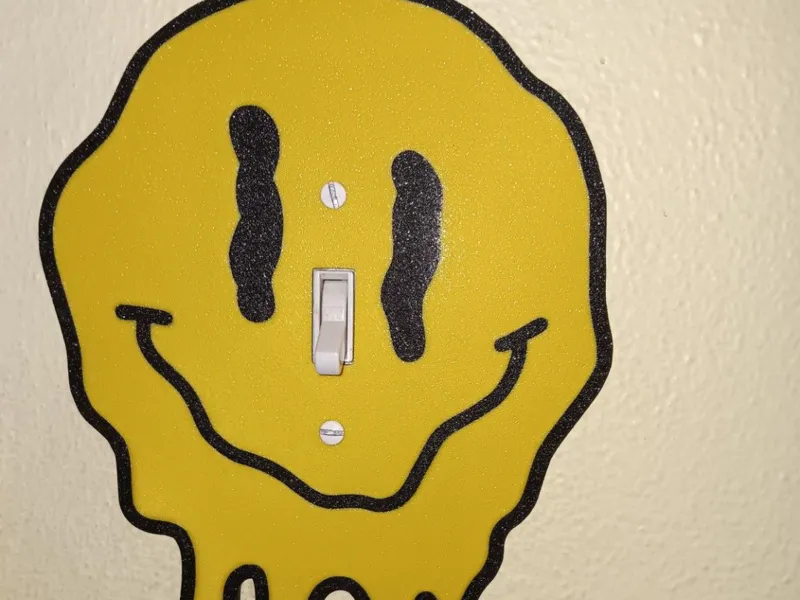 Melting Smiley Face Light Switch Cover
