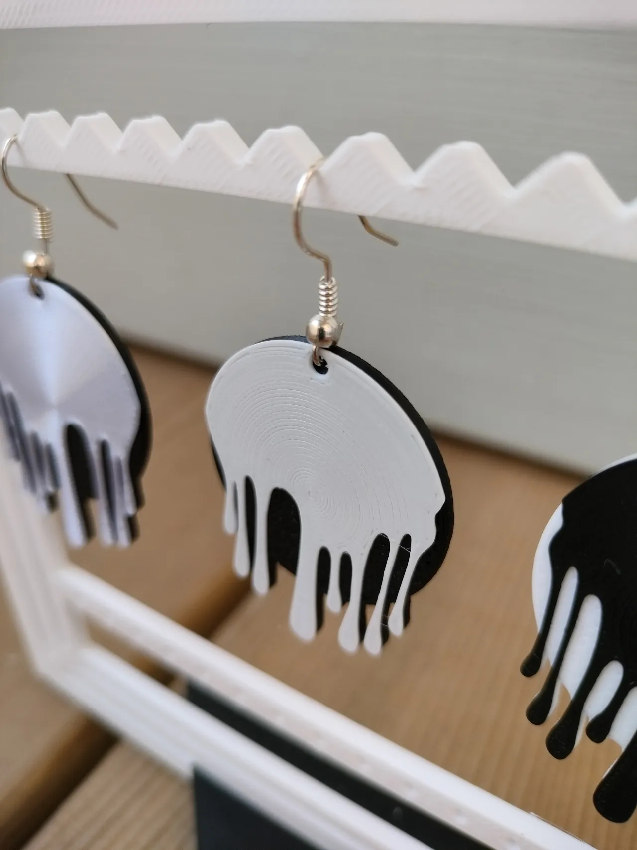 earring with a pattern of dripping paint view 2