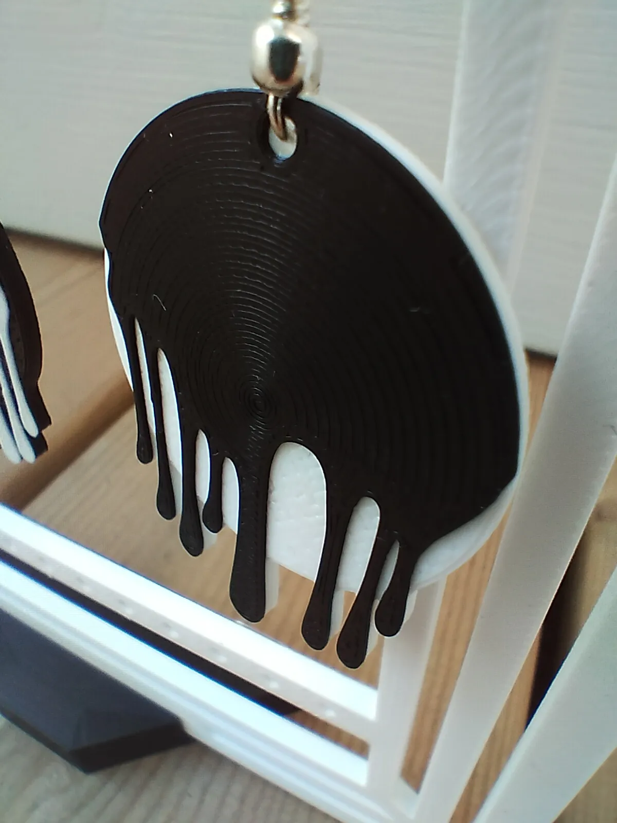 earring with a pattern of dripping paint view 3