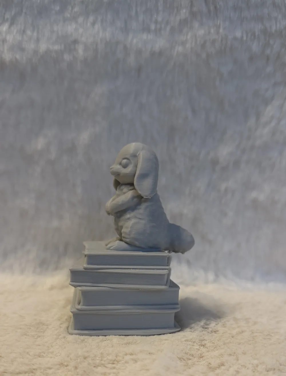 Cute Bunny Figurine on a Stack of Books - Free 3D Print Model - MakerWorld
