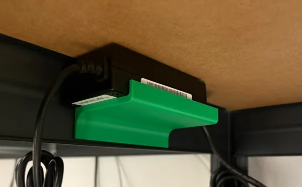 Support pour adaptateur secteur