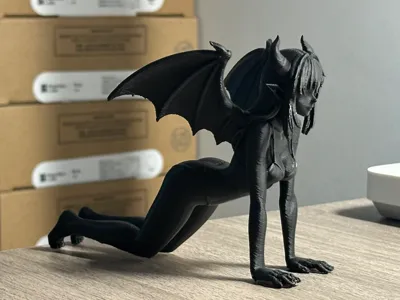 Devil girl doing yoga figurine phone stand