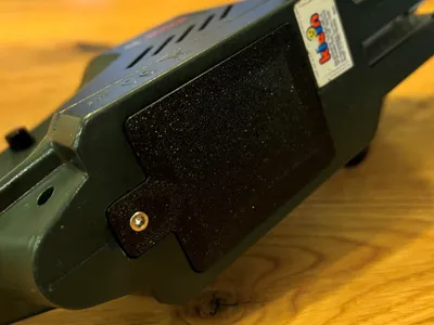 Battery cover Bosch Chainsaw Toy