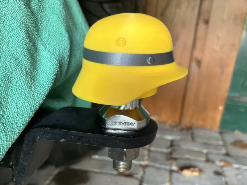 Firefighter helmet trailer hitch