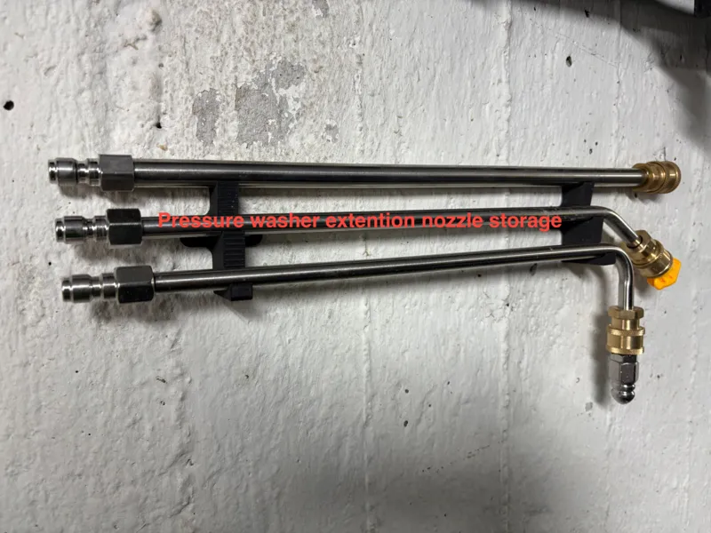 Pressure washer extension nozzle storage