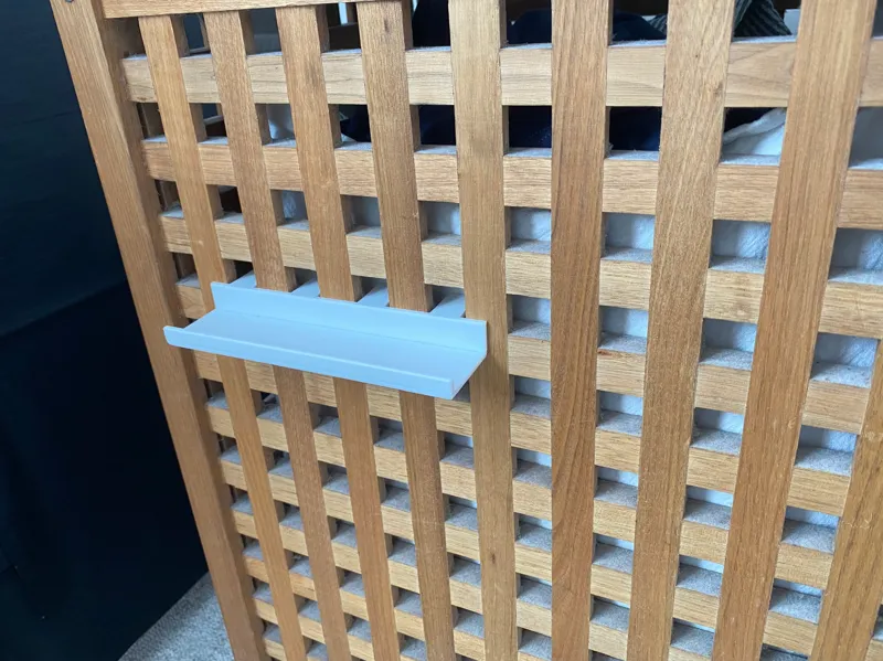 Very simple phone shelf for the side of my laundry basket