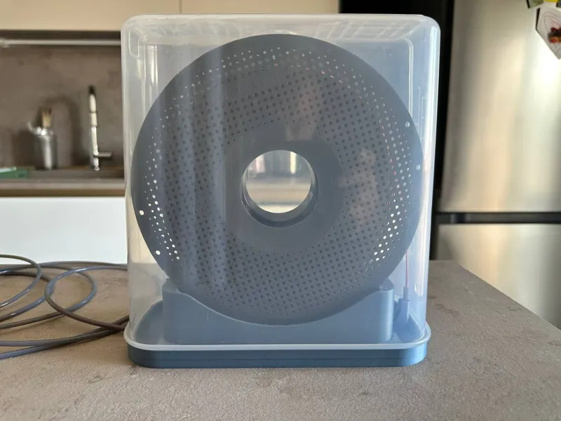 Spool Holder with Repurposed Airtight Container