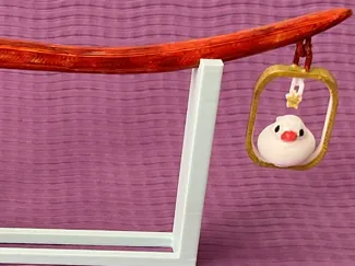 finch swinging hair stick