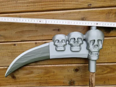 Halloween scythe with skulls on broomstick
