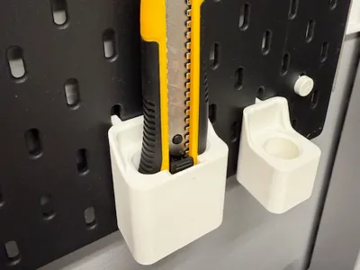 Utility knife holder for IKEA Skadis pegboard