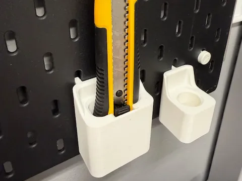 Utility knife holder for IKEA Skadis pegboard