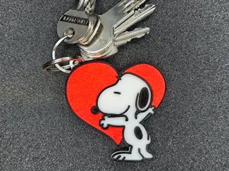 Snoopy hugging a heart keychain