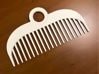 Comb with hole for hook