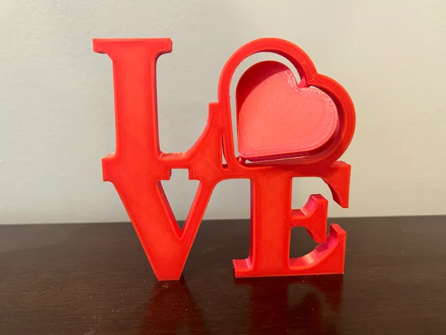 Love sign with spinning heart for valentines day