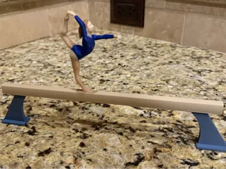 Girl gymnast on balance beam