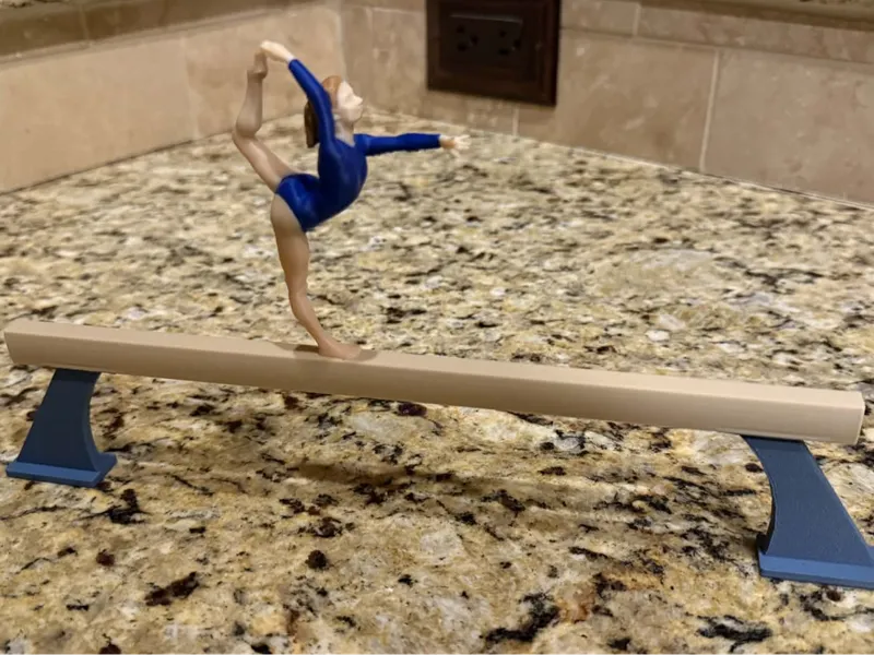 Girl gymnast on balance beam