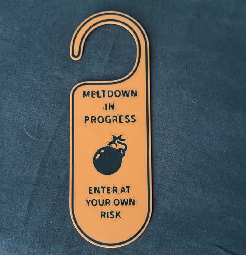 Meltdown in Progress Door Hanger