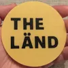 PLA, black font, yellow coaster, upside down, 0.20 mm layer, 2 walls, 15% infill, ironing