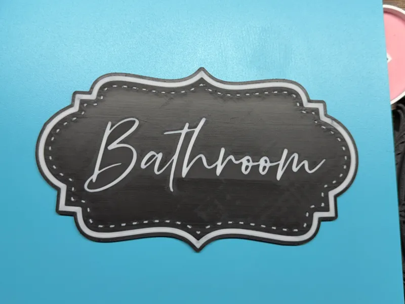 bathroom wall sign