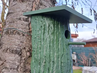 Birdhouse imitation tree trunk