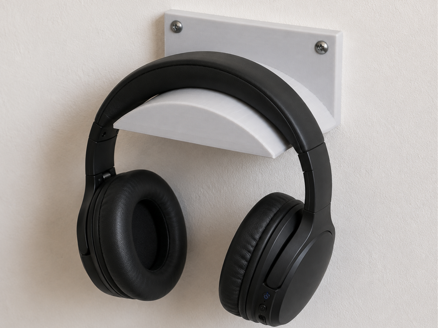 Wall-mounted helmet holder