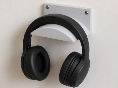 Wall-mounted helmet holder
